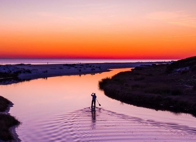 Paddleboard the Reef-Sheltered Waters of Saline Bay at Sunset