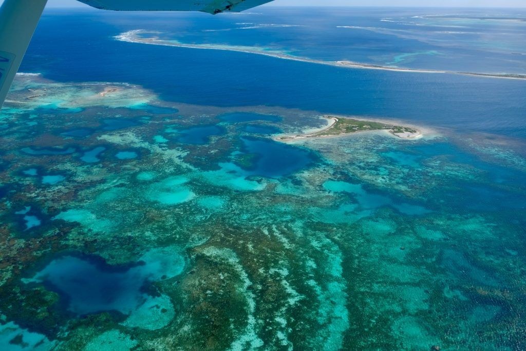 Scenic Flight Over the Abrolhos' Turquoise Reef Maze