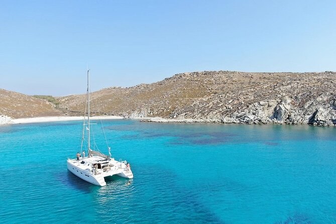 Catamaran to Rhenia: swim the turquoise coves, lunch on deck