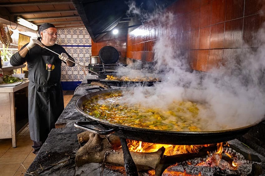 Cook Real Paella Valenciana Over Fire After a Central Market Shop