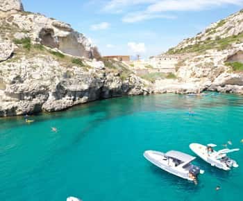 Gulf of Angels boat day around the Sella del Diavolo — swim coves below the Devil's Saddle