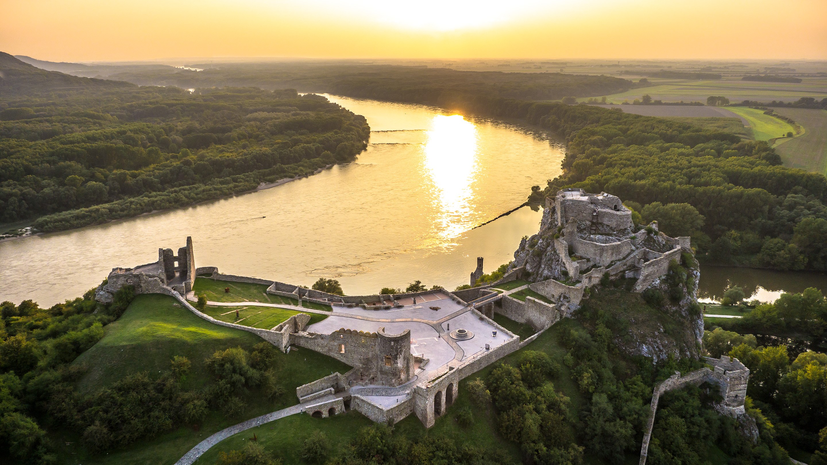 Devín Castle by Danube boat — the cliff-top ruin where the Morava meets the Danube