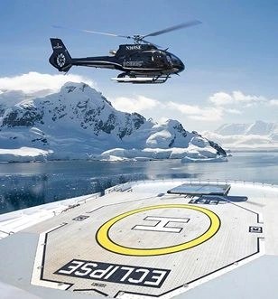 High-Altitude Eclipse Helicopter Flight into Totality