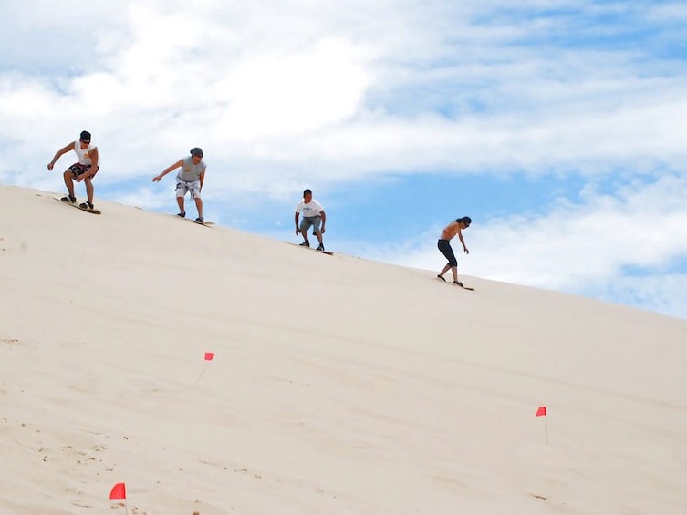 Sandboarding the Coastal Dunes: Adrenaline at the Desert's Edge