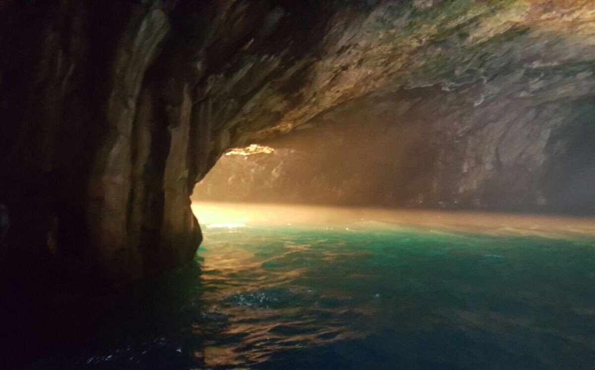 Cueva Bonita: Private Boat into a Sea Cave Lit by the Ocean